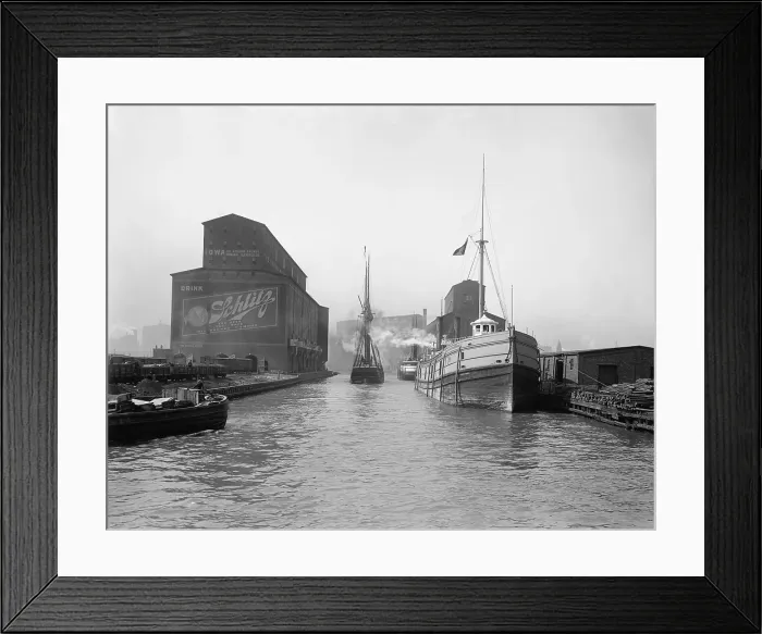 Framed Print : Cargo ships in the Chicago River. Warehouses and grain elevators line the urban river banks of the Port of Chicago. 1900. LC-D4-12626