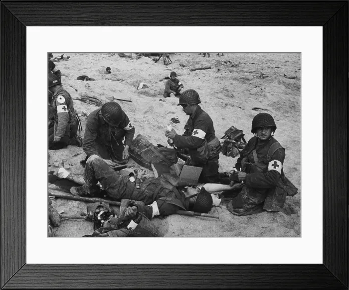 Framed Print : Medics treat a wounded U.S. soldier on D-Day. During the Normandy landings in Nazi occupied France, June 6, 1944, World War 2. (BSLOC_2014_2_36) Framed Print : Medics treat a wounded U.S. soldier on D-Day. During the Normandy landings in Nazi occupied France, June 6, 1944, World War 2. (BSLOC_2014_2_36)