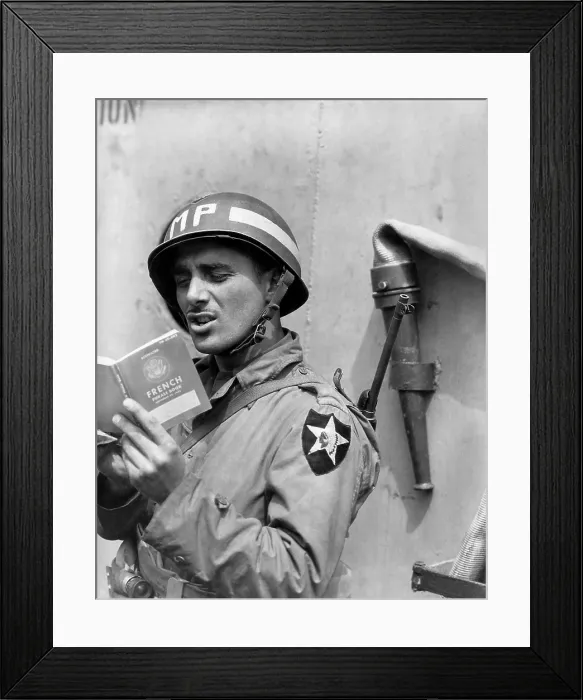 Framed Print : U.S. Army MP (Military Police) practices French on a ship taking him to Normandy. June 15, 1944. World War 2. (BSLOC_2014_2_77) Framed Print : U.S. Army MP (Military Police) practices French on a ship taking him to Normandy. June 15, 1944. World War 2. (BSLOC_2014_2_77)