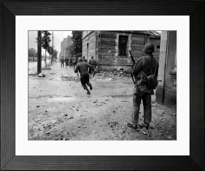 Framed Print : U.S. soldiers moving through the streets of Cherbourg. One by one they dash across a street to evade German sniper fire. June 22-25, 1944. France, Normandy Campaign, World War 2 Framed Print : U.S. soldiers moving through the streets of Cherbourg. One by one they dash across a street to evade German sniper fire. June 22-25, 1944. France, Normandy Campaign, World War 2