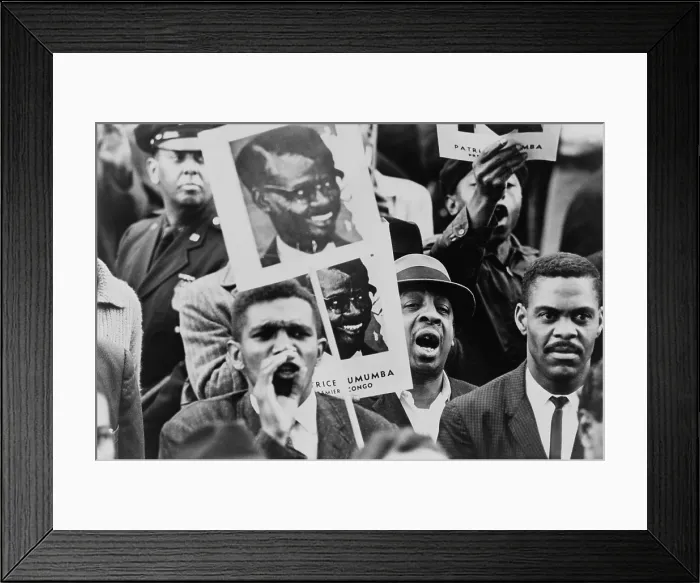 Framed Print : African American men at a Black Muslim demonstration carrying placards with portrait of Patrice Lumumba, Premier of Congo. Lumumba was executed on Jan. 17, 1961