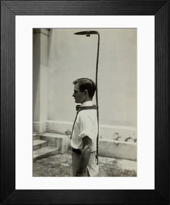 Framed Print : Model wears a slave bell rack, a used slave owners to handicap a runaway slave