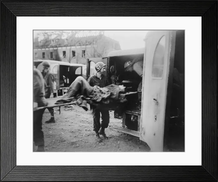 Framed Print : American medics place an almost-dead German slave laborer in an ambulance at Nordhausen. U.S. 3rd Army liberated the camp on April 12, 1945. Germany, World War 2 Framed Print : American medics place an almost-dead German slave laborer in an ambulance at Nordhausen. U.S. 3rd Army liberated the camp on April 12, 1945. Germany, World War 2
