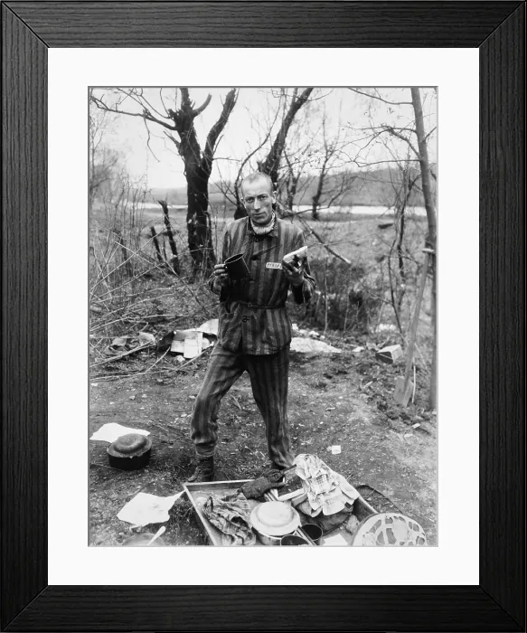 Framed Print : Belgian prisoner in German slave labor camp at Nordhausen, at time of liberation by U.S. Army. Prisoner holds a daily ration of a small cup of soup and a slice of bread