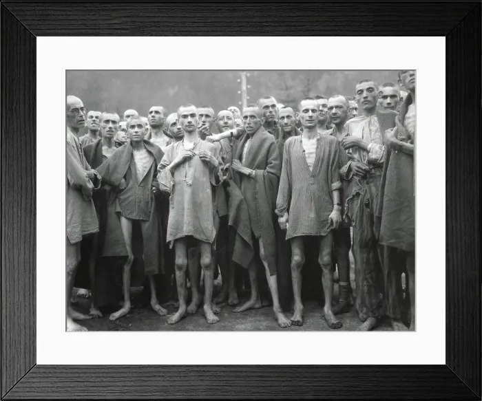 Framed Print : Inmates of Ebensee concentration camp after their liberation by American troops on May 6, 1945. Ebensee provided slave labor to build tunnels for armaments storage
