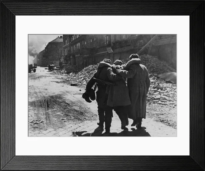 Framed Print : Wounded Soviet (Russian) soldier helped by two comrades in a street filled with rubble, Vienna. 1945 World War 2 photography by Evgenii Khaldei. (BSLOC_2014_8_29) Framed Print : Wounded Soviet (Russian) soldier helped by two comrades in a street filled with rubble, Vienna. 1945 World War 2 photography by Evgenii Khaldei. (BSLOC_2014_8_29)
