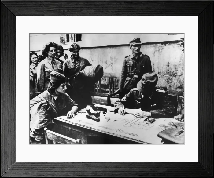 Framed Print : Soviet (Russia) woman soldier POW is interrogated by a German officer. Soviet women medics and nurses served on the front lines. April 1942. World War 2. (BSLOC_2014_8_46)