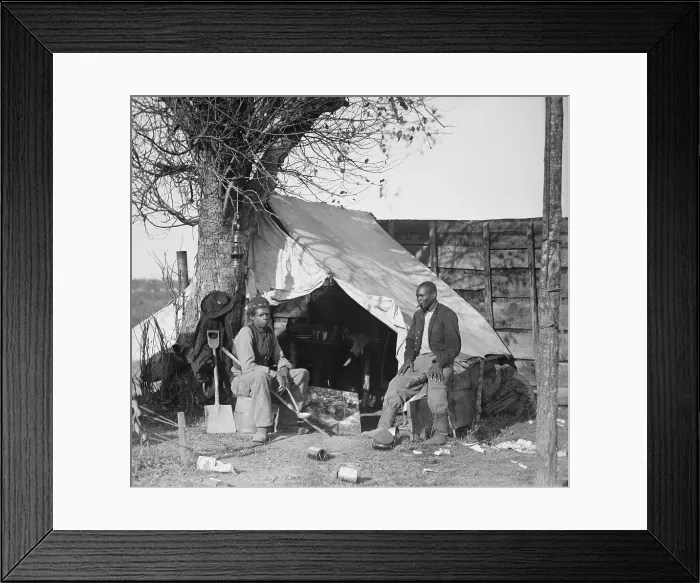 Framed Print : Contrabands of the Union Army during the Civil War sitting in front of a tent, one with cigar and the other with a soup ladle Framed Print : Contrabands of the Union Army during the Civil War sitting in front of a tent, one with cigar and the other with a soup ladle