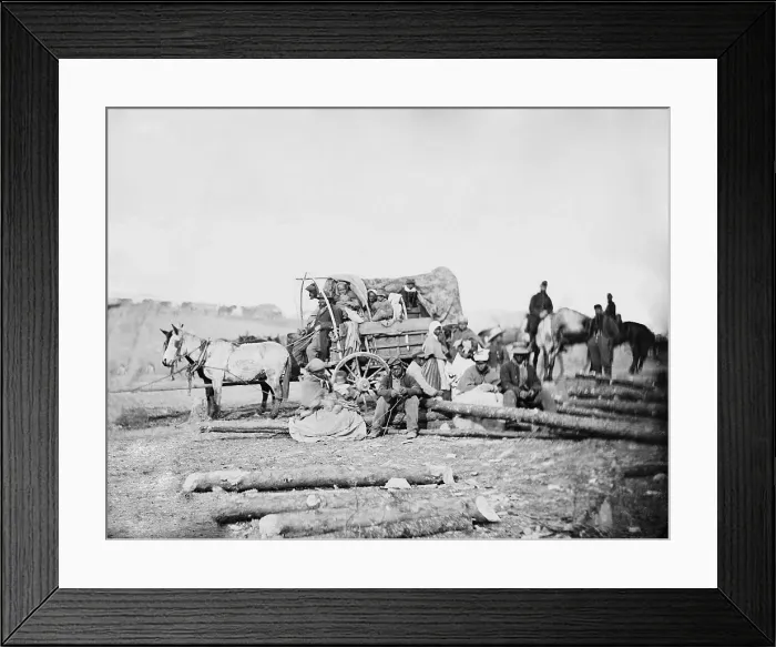 Framed Print : Arrival of an African American family in a Union army camp in January 1863, in a horse drawn covered wagon. Photo by David B Framed Print : Arrival of an African American family in a Union army camp in January 1863, in a horse drawn covered wagon. Photo by David B