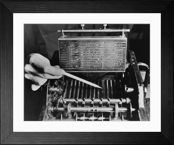 Framed Print : U.S. Bureau of the Census computer operator pointing out the interior mechanism of the punched card sorter, ca. 1940. (BSLOC_2013_8_186) Framed Print : U.S. Bureau of the Census computer operator pointing out the interior mechanism of the punched card sorter, ca. 1940. (BSLOC_2013_8_186)