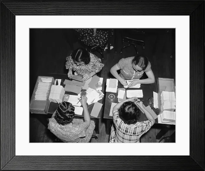 Framed Print : Social Security clerks work in teams, checking the original applications against the master punch cards Framed Print : Social Security clerks work in teams, checking the original applications against the master punch cards