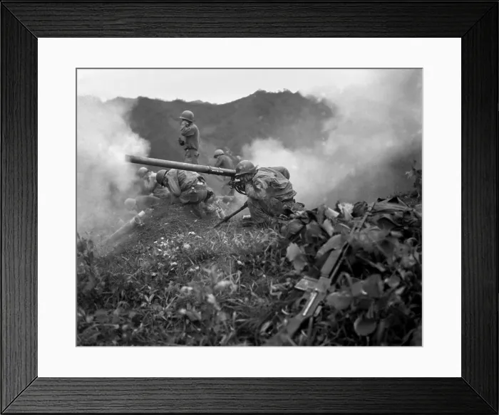 Framed Print : U.S. Army gunner (crouching foreground), fires a 75mm recoilless rifle. They are fighting near Oetlook-tong, Korea, in support of infantry units directly across the valley Framed Print : U.S. Army gunner (crouching foreground), fires a 75mm recoilless rifle. They are fighting near Oetlook-tong, Korea, in support of infantry units directly across the valley