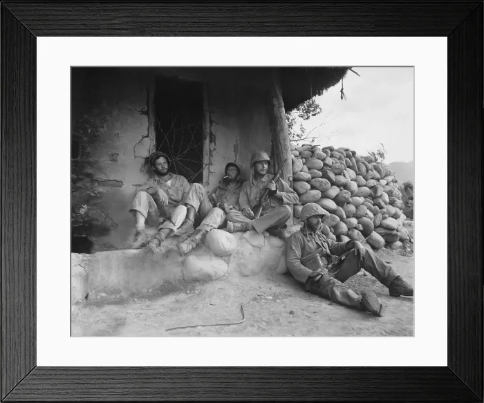 Framed Print : U.S. Marines relax after killing an enemy sniper housed in the Korean hut. Sept. 24, 1951. Korean War, 1950-53. (BSLOC_2014_11_114)
