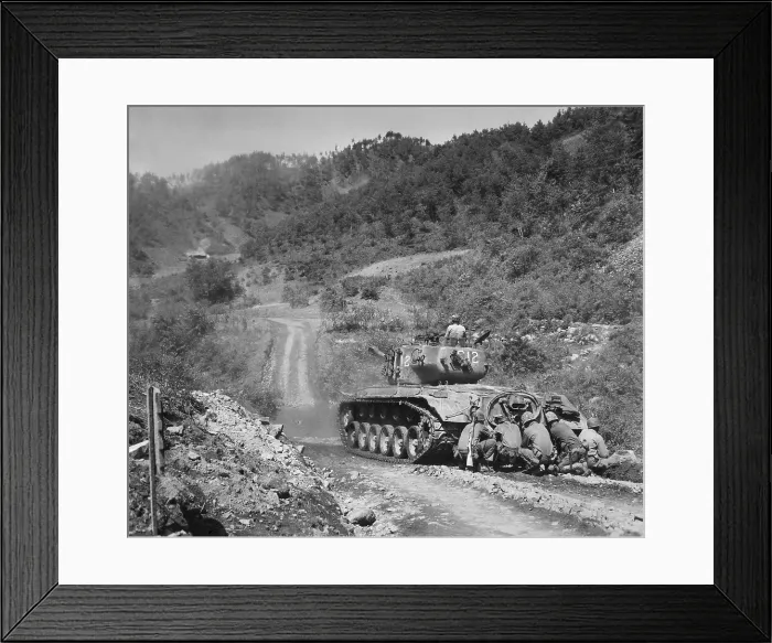 Framed Print : U.S. Marine infantrymen take cover behind a tank while it fires on Communist troops ahead. Hongchon Area, Central Korea, May 22, 1951. Korean War, 1950-53. (BSLOC_2014_11_110) Framed Print : U.S. Marine infantrymen take cover behind a tank while it fires on Communist troops ahead. Hongchon Area, Central Korea, May 22, 1951. Korean War, 1950-53. (BSLOC_2014_11_110)