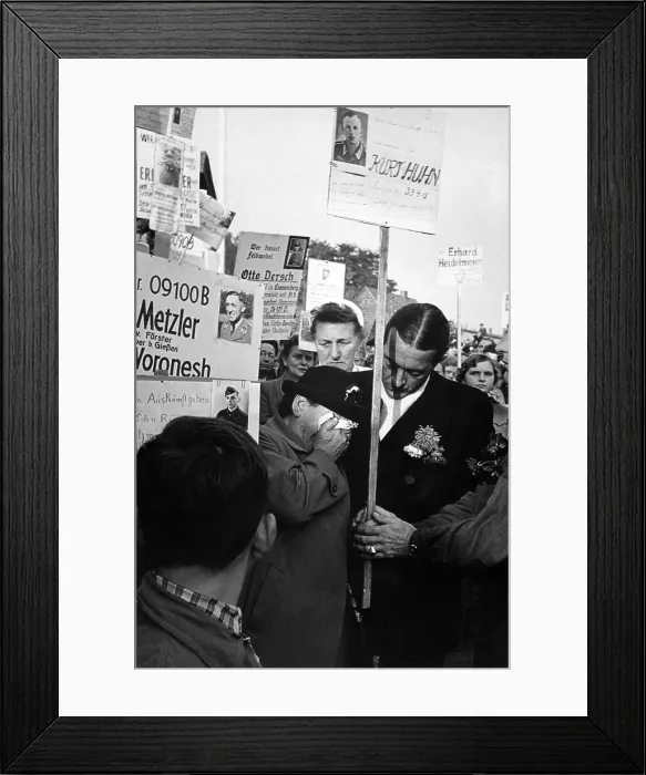Framed Print : In 1955, 15, 000 German POW's were finally released by the Soviet Union (Russia). A POW returning to West Germany recognized a man in a photo held by an elderly women Framed Print : In 1955, 15, 000 German POW's were finally released by the Soviet Union (Russia). A POW returning to West Germany recognized a man in a photo held by an elderly women