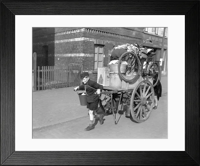 Framed Print : A boy pulls, as his mother pushes, a cart loaded with their possessions in Uerdingen, Germany. U.S Framed Print : A boy pulls, as his mother pushes, a cart loaded with their possessions in Uerdingen, Germany. U.S