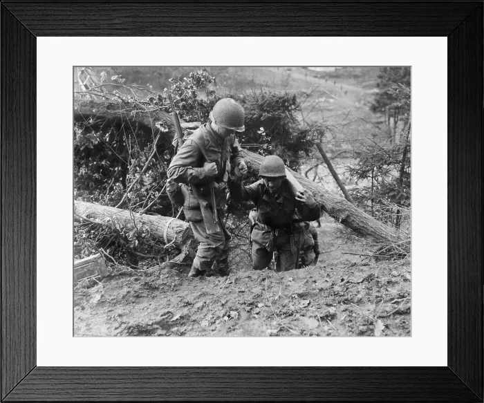 Framed Print : U.S. Infantrymen, in the Hurtgen Forest. One soldier helps another carrying heavy weapon as they climb a steep trail. Nov. 18, 1944. Near Duren, Germany, World War 2 Framed Print : U.S. Infantrymen, in the Hurtgen Forest. One soldier helps another carrying heavy weapon as they climb a steep trail. Nov. 18, 1944. Near Duren, Germany, World War 2
