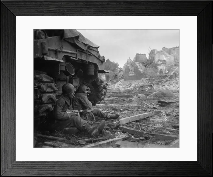 Framed Print : U.S. Infantrymen sheltering behind a M-4 Sherman tank during heavy German shelling. Dec. 11, 1944. Geich, Germany. World War 2. (BSLOC_2014_8_60)