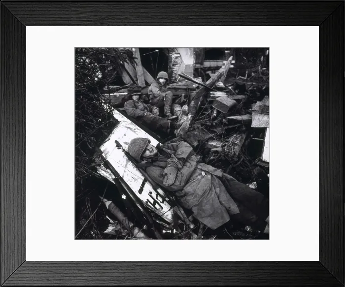 Framed Print : U.S. soldiers resting among ruins of building, with one GI lying on plank. On the Siegfried Line, in the Rhine Valley in Feb. 1945. World War 2. Photo by Toni Frissell Framed Print : U.S. soldiers resting among ruins of building, with one GI lying on plank. On the Siegfried Line, in the Rhine Valley in Feb. 1945. World War 2. Photo by Toni Frissell