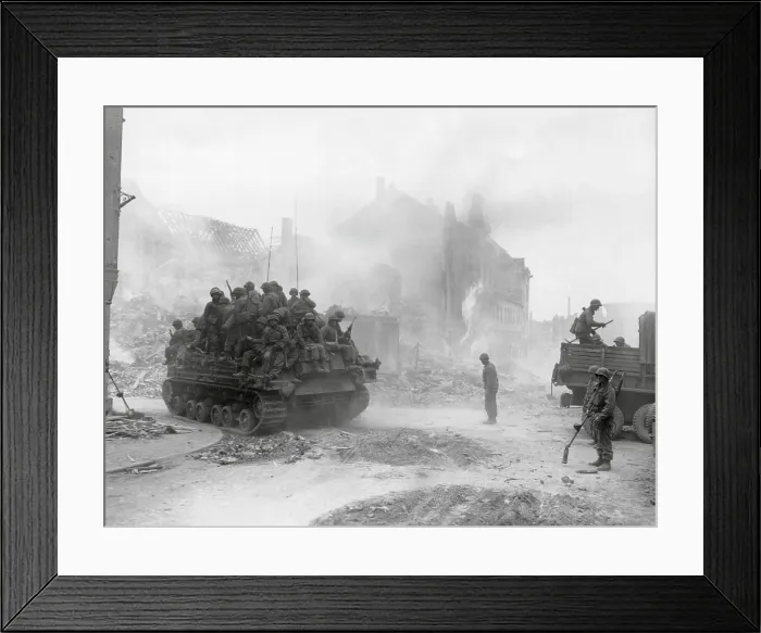 Framed Print : U.S. soldiers of the 3rd Division Infantry, packed on a tank in Zweibrucken, Germany. Minesweeping engineers stand by in the midst of smoking ruins of the industrial city Framed Print : U.S. soldiers of the 3rd Division Infantry, packed on a tank in Zweibrucken, Germany. Minesweeping engineers stand by in the midst of smoking ruins of the industrial city