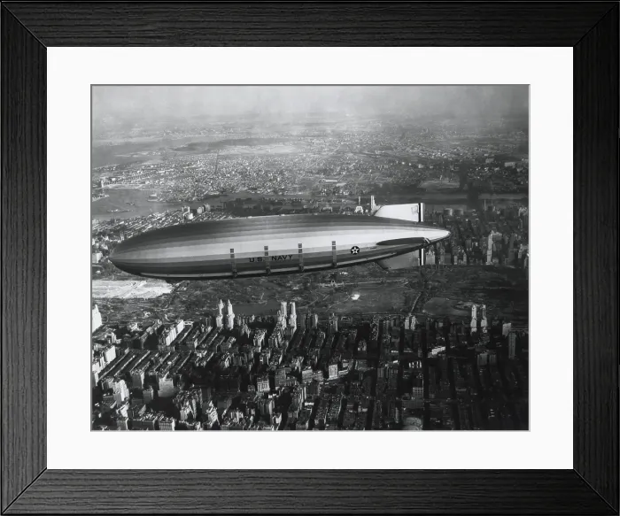 Framed Print : USS Akron in flight over New York City, ca. 1932. Akron, a helium-filled rigid airship of the U.S Framed Print : USS Akron in flight over New York City, ca. 1932. Akron, a helium-filled rigid airship of the U.S
