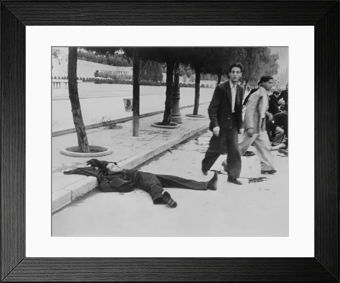 Framed Print : Demonstrators leaving a man dead in the Athens Street on Dec, 18, 1944. After the Germans were defeated in Greece in Oct