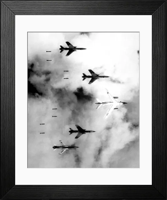 Framed Print : Bombing North Vietnam. US Air Force F-105 Thunderchief bomb a military target through low clouds over the southern panhandle of North Viet Nam. June 14, 1966 Framed Print : Bombing North Vietnam. US Air Force F-105 Thunderchief bomb a military target through low clouds over the southern panhandle of North Viet Nam. June 14, 1966
