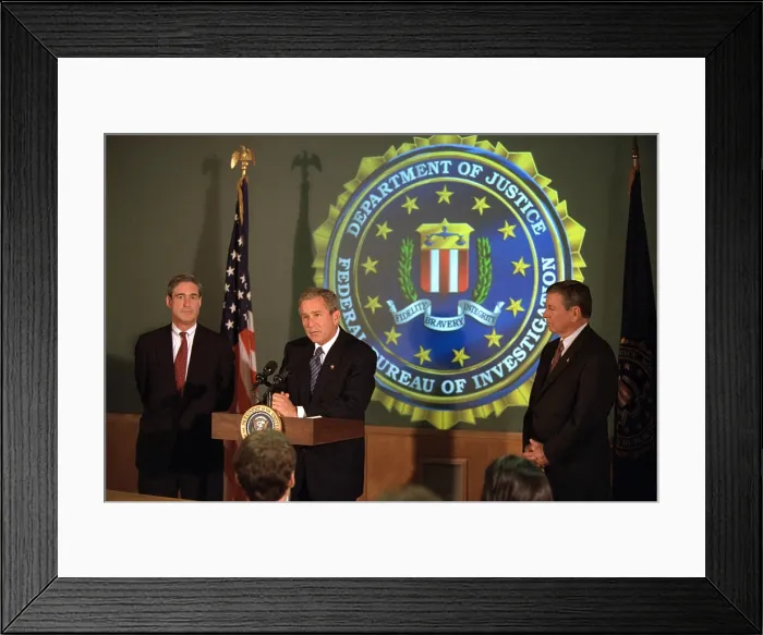 Framed Print : President George W. Bush at FBI Headquarters, Sept. 25, 2001. He is flanked by Director Robert Mueller, left, and U.S. Attorney General John Ashcroft. (BSLOC_2015_2_168)