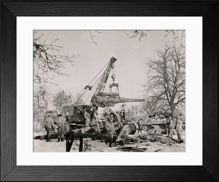 Framed Print : U.S. artillerymen in France assemble their 8 inch gun with the aid of a mechanical hoister. Fall-Winter 1944-45. World War 2. (BSLOC_2014_10_156)