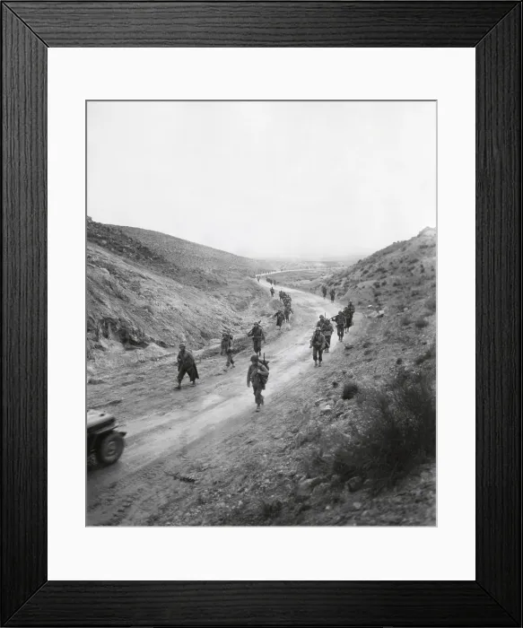 Framed Print : U.S. 16th Infantry, 2nd Battalion moving through the Kasserine Pass on Feb. 26, 1943. Four days before U.S Framed Print : U.S. 16th Infantry, 2nd Battalion moving through the Kasserine Pass on Feb. 26, 1943. Four days before U.S
