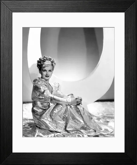 Framed Print : ARTISTS AND MODELS ABROAD, Joan Bennett wearing gold lame negligee designed by Edith Head, 1938