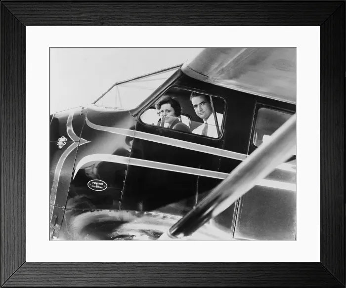Framed Print : Howard Hughes and actress Nancy Carroll just before taking off for Los Angeles, 1937. Carroll was a A-list actress from 1927 to the mid-1930s, but retired from films in 1938 Framed Print : Howard Hughes and actress Nancy Carroll just before taking off for Los Angeles, 1937. Carroll was a A-list actress from 1927 to the mid-1930s, but retired from films in 1938