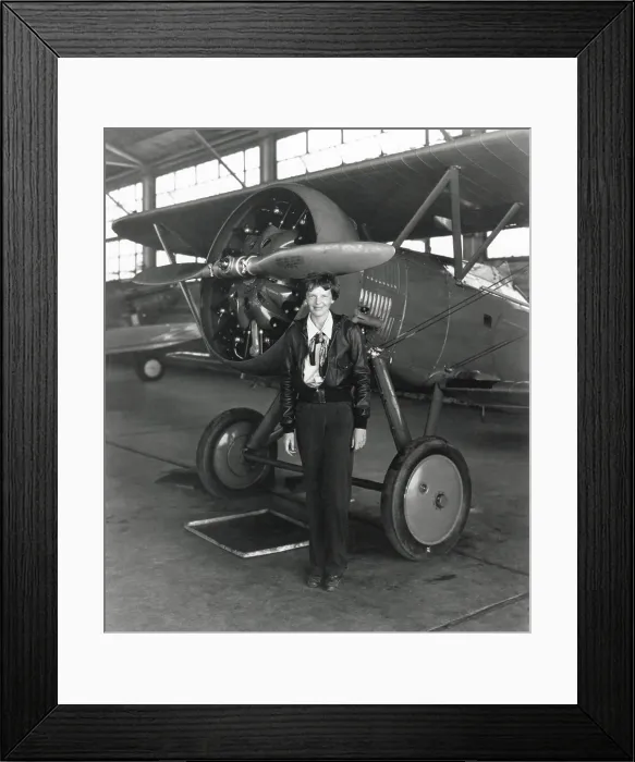 Framed Print : Amelia Earhart standing next to an airplane, July 30, 1936. (BSLOC_2013_8_214) Framed Print : Amelia Earhart standing next to an airplane, July 30, 1936. (BSLOC_2013_8_214)