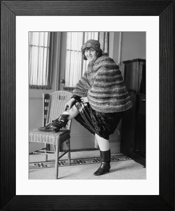 Framed Print : Young woman hiding a flask in her Russian boot, during prohibition, Washington DC, 1922. (BSLOC_2016_7_4)