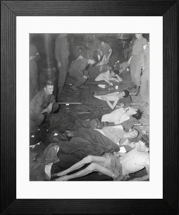 Framed Print : Emaciated American POWs taken prisoner Battle of the Bulge receive medical care. Only 63 men survived of 350 prisoners taken five months earlier