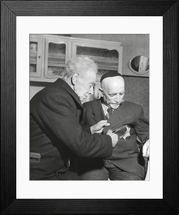 Framed Print : Simon Trampatter, a 83-year-old Dutch Jew cuts the star off the coat of his friend, Joseph Keller Framed Print : Simon Trampatter, a 83-year-old Dutch Jew cuts the star off the coat of his friend, Joseph Keller