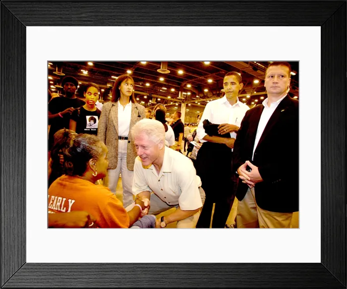 Framed Print : President Bill Clinton greets an Katrina evacuee at the Houston Astrodome. Sept 5, 2005. He and President George H.W