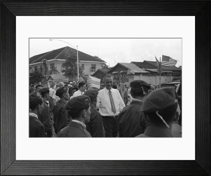 Framed Print : Vice-President Lyndon Johnson among group of Vietnamese soldiers and Americans. President Kennedy increased American forces to 12, 000 U.S. military advisors in Vietnam by 1962