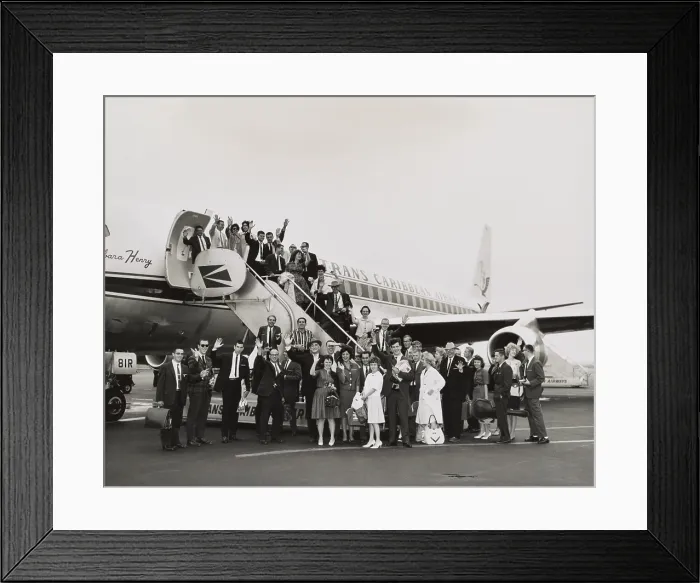 Framed Print : Peace Corps volunteers boarding a Trans Caribbean Airways jet bound for San Juan, Puerto Rico. July 16, 1962. The 54 new Peace Corpsmen trained at Camp Radley, near Arecibo, P.R