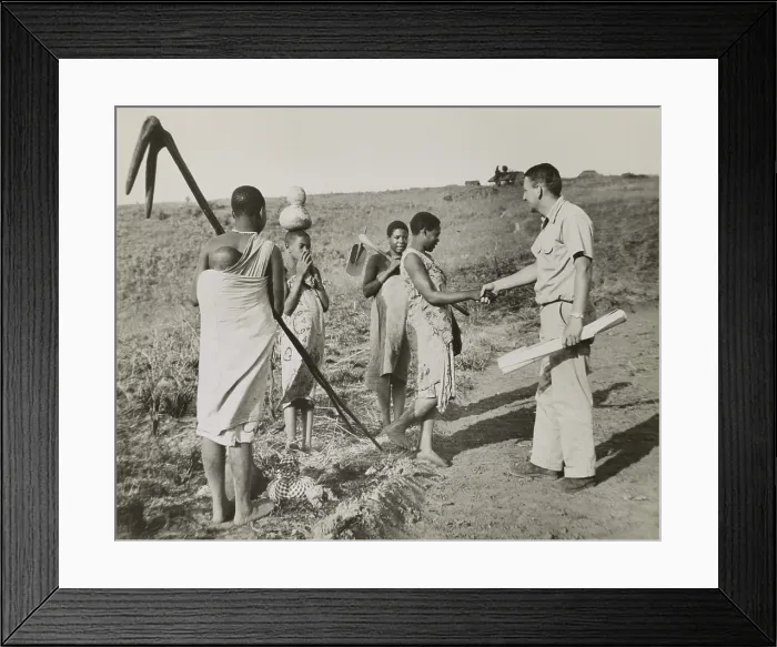 Framed Print : Peace Corps volunteer meeting four village women working in fields, Tanganyika, Oct. 17, 1962
