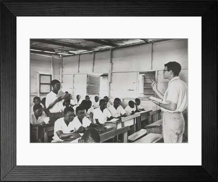 Framed Print : Peace Corpsman teaches English in Ghana. The students are all young men or teenagers in a simple schoolhouse. April 18, 1962. (BSLOC_2015_2_230)