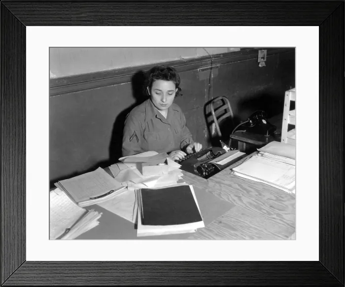 Framed Print : U.S. WAC Private First Class typing at a rough plywood desk in Normandy, France in 1944. World War 2. (BSLOC_2014_10_205) Framed Print : U.S. WAC Private First Class typing at a rough plywood desk in Normandy, France in 1944. World War 2. (BSLOC_2014_10_205)
