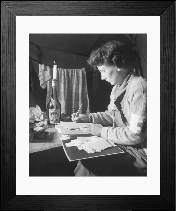 Framed Print : U.S. Army Nurse writes a letter home after 12 hours of work. She is at the 2nd Evacuation Hospital, somewhere in France. July 24, 1944. World War 2. (BSLOC_2014_10_207)