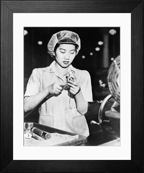 Framed Print : Wong Ruth Mae Moy working on an American aircraft engine part. She is a young Chinese women who survived the Canton bombings. March 1943. World War 2. (BSLOC_2014_10_213)