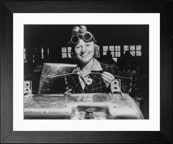 Framed Print : Woman welding a fuel tank for a Hawker Hurricane fighter airplane at Fort William, Ontario, Canada. 1941. World War 2. (BSLOC_2014_10_219)
