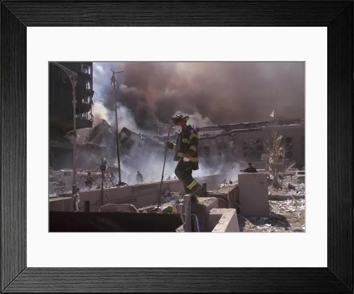 Framed Print : Fire fighters amid smoking rubble following September 11th terrorist attack on World Trade Center. At left is still standing WTC 6 Framed Print : Fire fighters amid smoking rubble following September 11th terrorist attack on World Trade Center. At left is still standing WTC 6