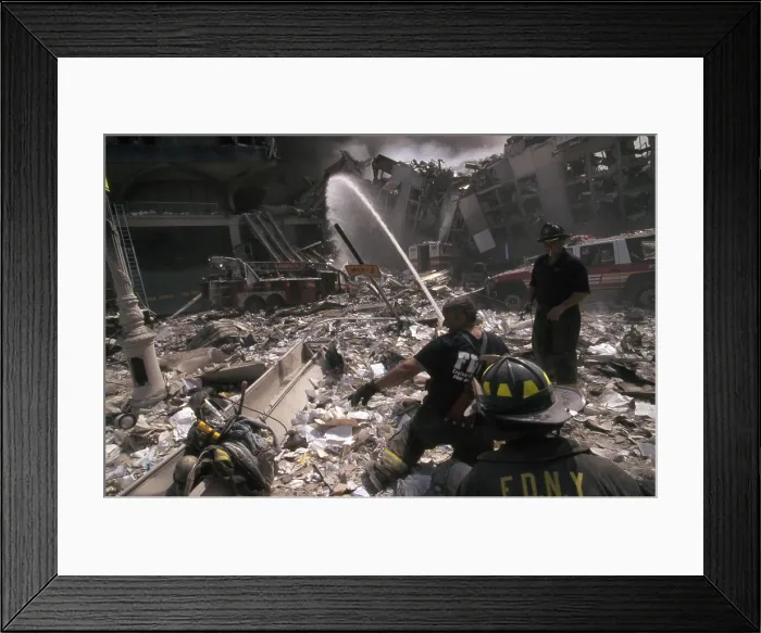 Framed Print : Fire fighters set up a hose amid smoking rubble following September 11th terrorist attack on World Trade Center. At left is still standing WTC 6 Framed Print : Fire fighters set up a hose amid smoking rubble following September 11th terrorist attack on World Trade Center. At left is still standing WTC 6