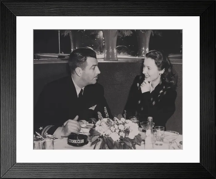 Framed Print : Navy Lieutenant Robert Taylor, with his wife, movie star Barbara Stanwyck at the Stork Club. In the Navy he was a flight instructor and appeared in instructional films. Ca Framed Print : Navy Lieutenant Robert Taylor, with his wife, movie star Barbara Stanwyck at the Stork Club. In the Navy he was a flight instructor and appeared in instructional films. Ca