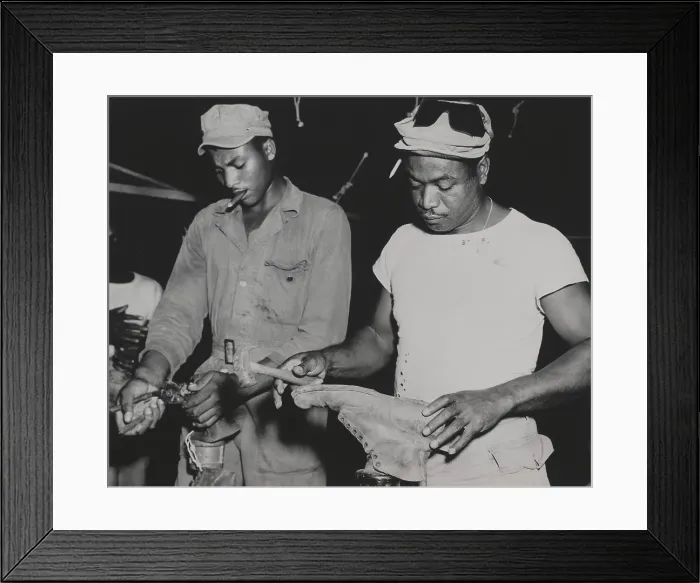 Framed Print : African American quartermaster soldiers repairing battle boots worn by fighting troops. They were stationed in the Marianas Island. Feb. 28, 1945. World War 2. (BSLOC_2014_10_227)