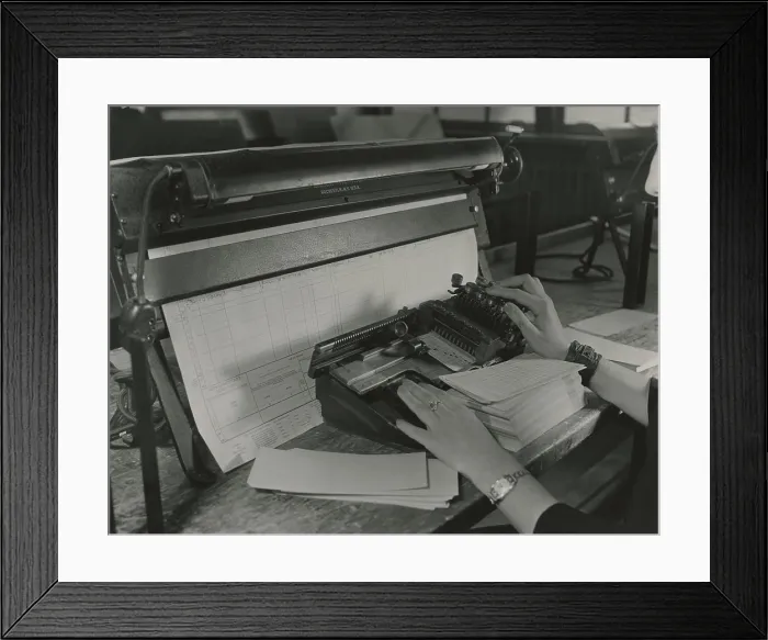 Framed Print : U.S. Census worker transferring information from a questionnaire to a punch card, ca. 1940. (BSLOC_2013_8_277) Framed Print : U.S. Census worker transferring information from a questionnaire to a punch card, ca. 1940. (BSLOC_2013_8_277)